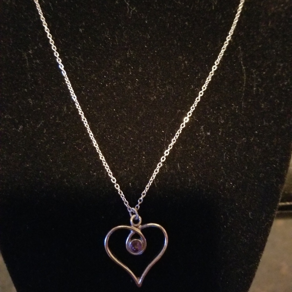 Silver tone heart pendant chain necklace.